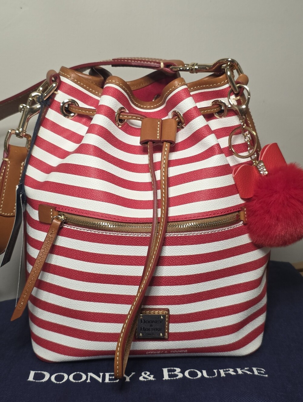Dooney & Bourke Red and White Striped Drawstring Bucket Bag with Tan Trim